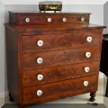 F41. Flame mahogany empire style chest. 39”h x 37.5”w x 18”d 